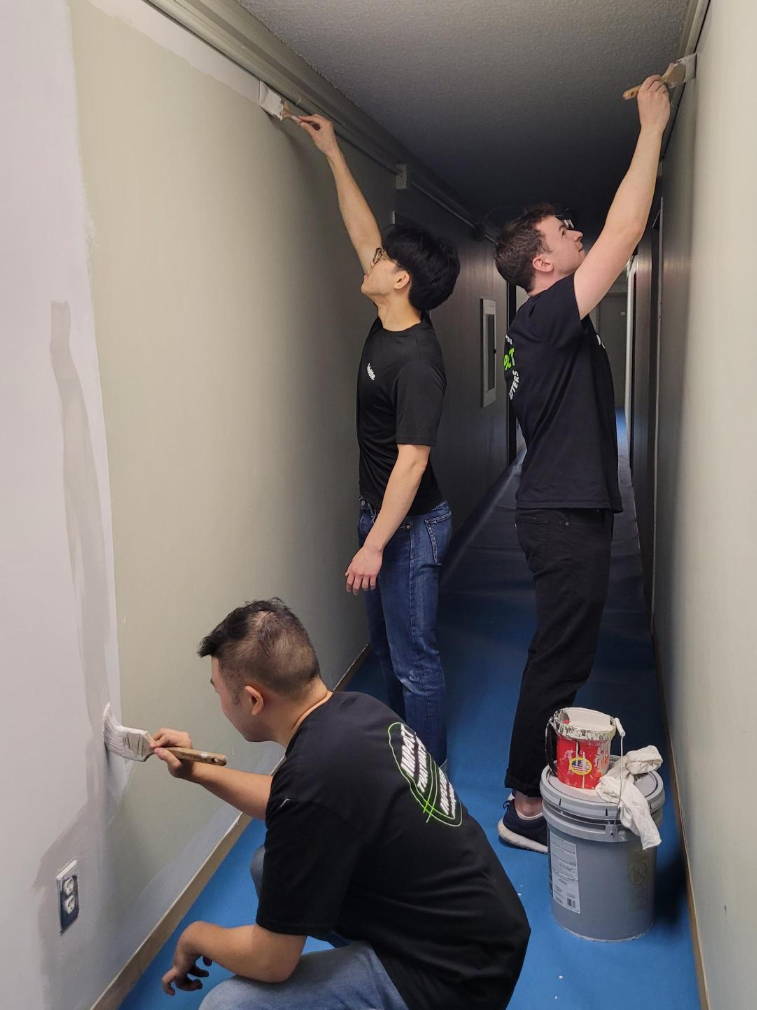 Volunteers painting walls